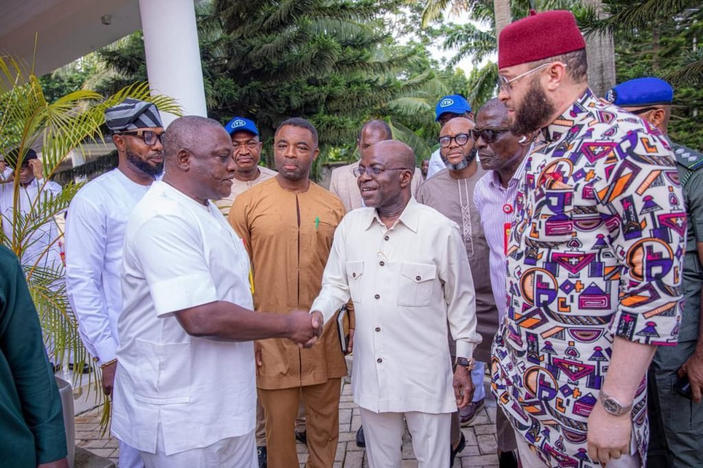 alex otti and innocent chukwuma exchanging pleasantries